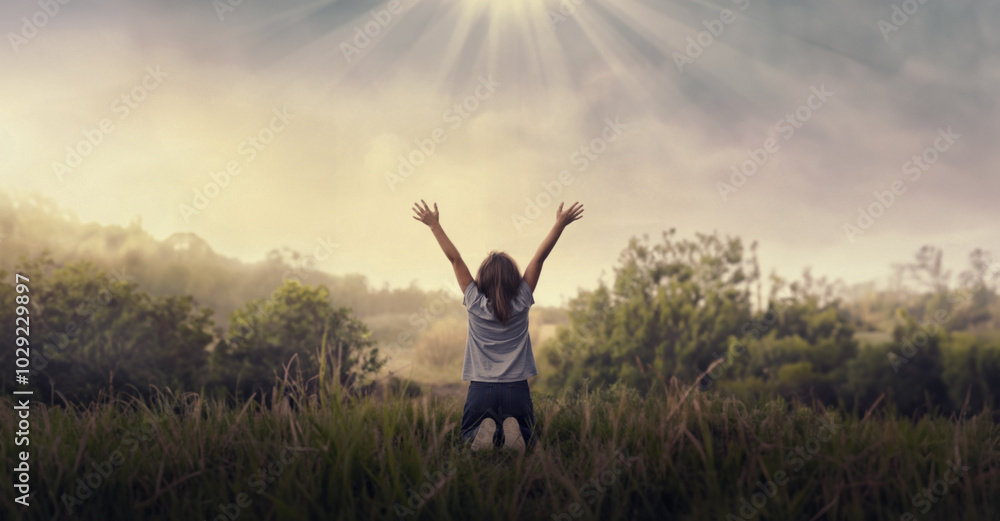 Praising the lord concept. Back view of a young girl with her arms raised to the sky in thankfulness and prayer. Themes such as Embrace, Sacred, Testimony, Proclaim, Witness, Scripture, Psalms Praising the lord concept. Back view of a young girl with her arms raised to the sky in thankfulness and prayer. Themes such as Embrace, Sacred, Testimony, Proclaim, Witness, Scripture, Psalms