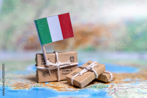 Fototapeta Naklejka Na Ścianę i Meble -  Flag of Italy near the parcels on the world map. World trade. Exports and imports of goods. Economy of the country.
