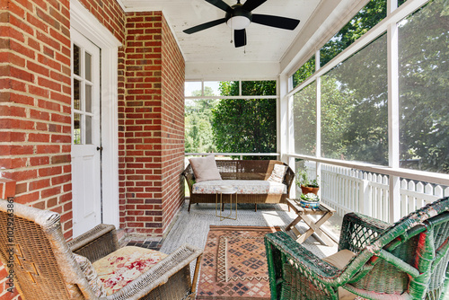 Vászonkép Charming Rustic Porch With Wicker Furniture And Fan.