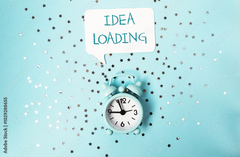 Fototapeta premium A clock with the words idea loading written above it