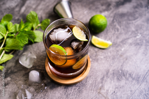 Photography Cold Cuba Libre or Long island iced tea cocktail with brown rum, cola, mint, lim