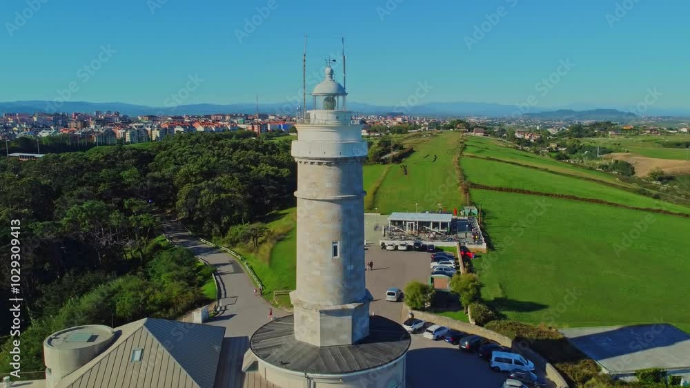 Aerial view of the Cape Mayor lighthouse (Faro de Cabo Mayor) on the rocky coast in Santander, Spain. Aerial view of the Cape Mayor lighthouse (Faro de Cabo Mayor) on the rocky coast in Santander, Spain.