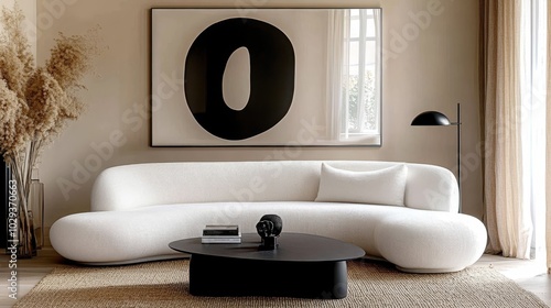 Minimalist living room, curved white sofa, black round coffee table, abstract black shape artwork, beige walls, sisal rug, black table lamp, dried pampas grass, window with sheer curtains, monochromat photo