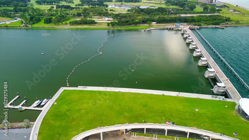 Photography Marina Barrage, Singapore: Aerial view of cityscape and coastline on a overcast
