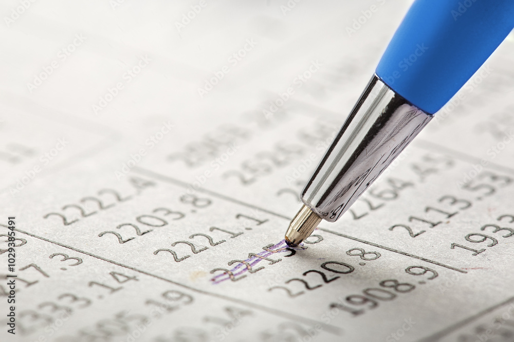 Accounting document with pen, money, coins and checking financial chart. Concept of banking, financial report and financial audit. Accounting document with pen, money, coins and checking financial chart. Concept of banking, financial report and financial audit.