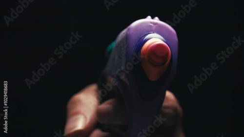 Macro shot of toy gun shooting