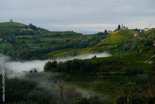 Paesaggio delle Langhe in una mattina di nuvole basse a Rocchetta Palafea in provincia di Asti, Piemonte, Italia. photo