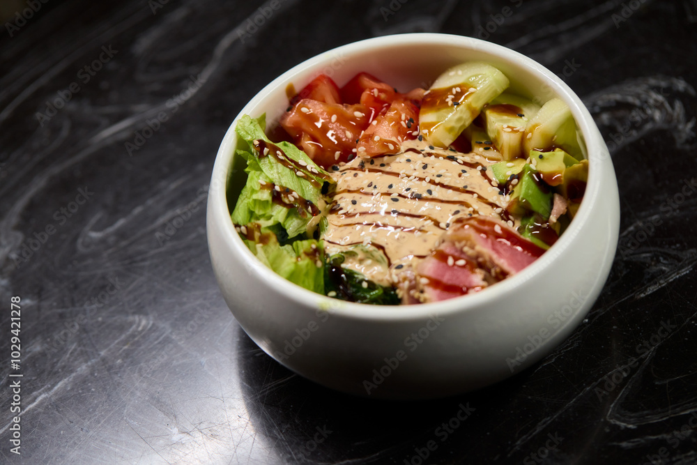 A Fresh and Colorful Salad Bowl that features Grilled Chicken and a Variety of Vegetables A Fresh and Colorful Salad Bowl that features Grilled Chicken and a Variety of Vegetables