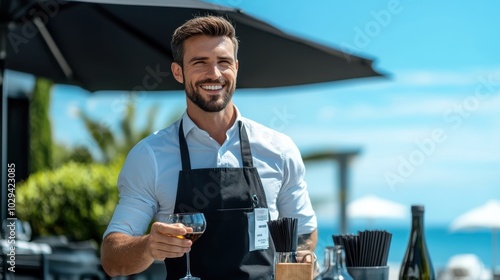 Fototapeta Naklejka Na Ścianę i Meble -  A cheerful waiter in a black apron and white shirt serves wine at an outdoor cafe, showcasing hospitality and a pleasant atmosphere on a sunny day.