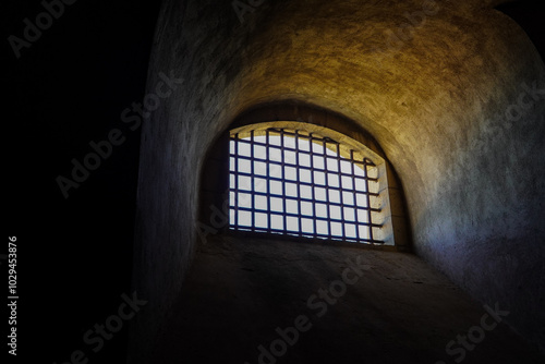 A barred window in Castel Sant'Elmo, a 14th-century fortress and former prison that is located on top of the vomero hill in Naples.  photo