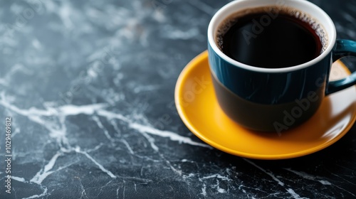 An enticing image of a moody coffee scene with a blue cup filled with black coffee placed on a marble table, portraying a sense of warmth and relaxation. photo