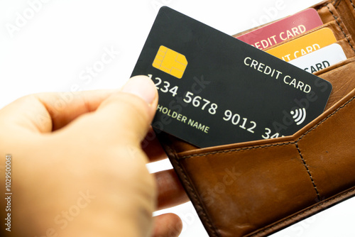 Taking out Credit Card from Wallet for eCommerce Shopping Spend and Payment photo