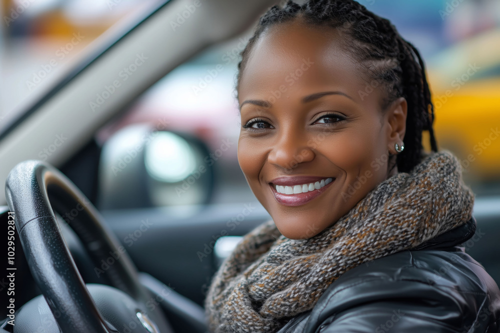 A joyful woman enjoying her drive in a cozy urban setting on a sunny day A joyful woman enjoying her drive in a cozy urban setting on a sunny day