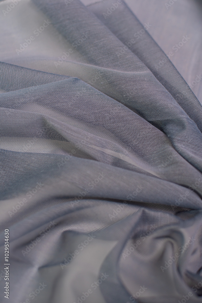 Fototapeta premium Samples of dark gray fabric for tulle. Light and transparent fabric for curtains