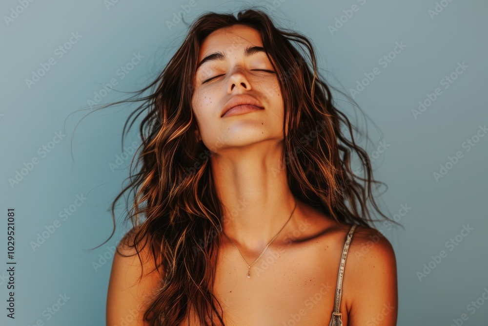 Young woman relaxing on bed with closed eyes, serene expression and natural beauty Young woman relaxing on bed with closed eyes, serene expression and natural beauty