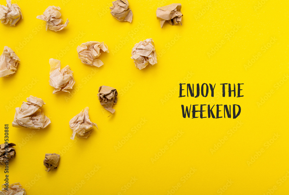 A yellow background with a pile of crumpled paper on it A yellow background with a pile of crumpled paper on it