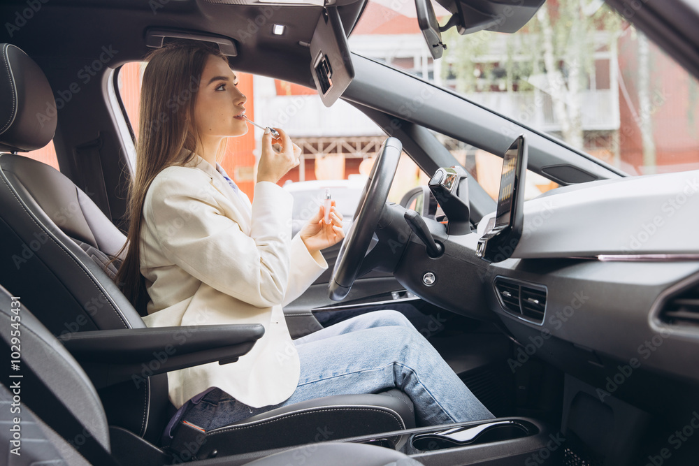 Woman Applying Lipstick Inside Modern Car with Elegant Style Woman Applying Lipstick Inside Modern Car with Elegant Style
