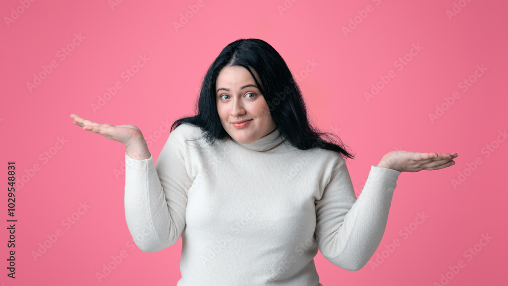 I Don't Know. Unsure Overweight Woman Shrugging Shoulders And Smiling Over Pink Studio Background With Free Space I Don't Know. Unsure Overweight Woman Shrugging Shoulders And Smiling Over Pink Studio Background With Free Space