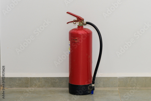 Wallpaper Mural Red fire extinguisher on tile floor Torontodigital.ca