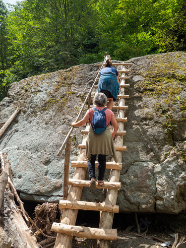 Tourists on Tisita river Gorge, Vrancea Mountains, Romania photo