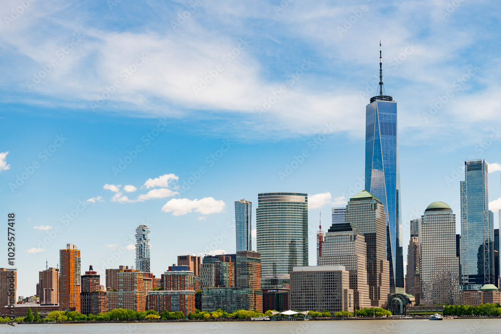Fototapeta premium A view of the New York financial district fom Paulus Hook Pier in Jersey City, New Jersey.New York, United States. Manhattan New York NY NYC Skyline. Lower Manhattan and One World Trade Center in New