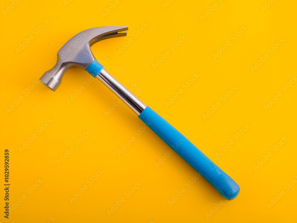 hammer on a yellow background hammer on a yellow background