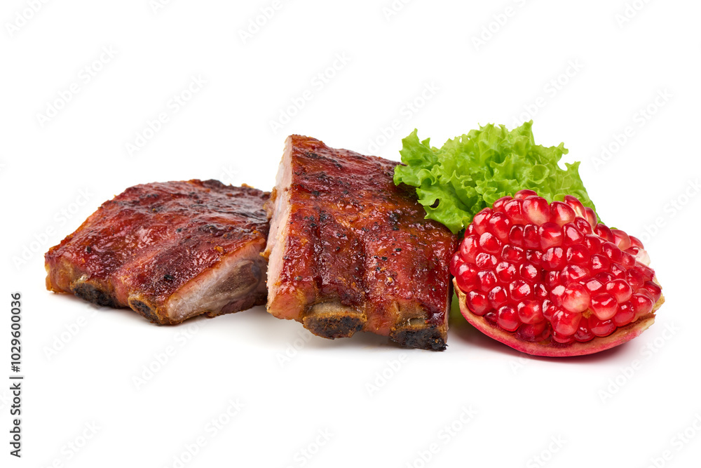 Grilled pork ribs with barbecue sauce, lettuce, and cherry tomatoes, isolated on white background. Grilled pork ribs with barbecue sauce, lettuce, and cherry tomatoes, isolated on white background.