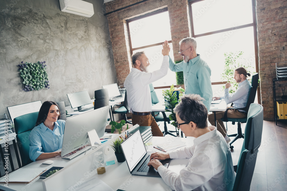 Photo of teamwork people working together unity hands highfive comfortable modern office loft room interior indoors workspace Photo of teamwork people working together unity hands highfive comfortable modern office loft room interior indoors workspace