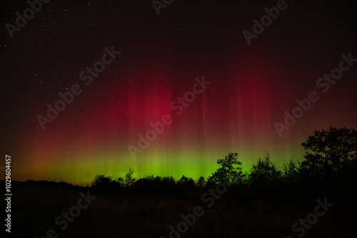 Aurora pillars shine in the night sky above the allegheny mountains photo