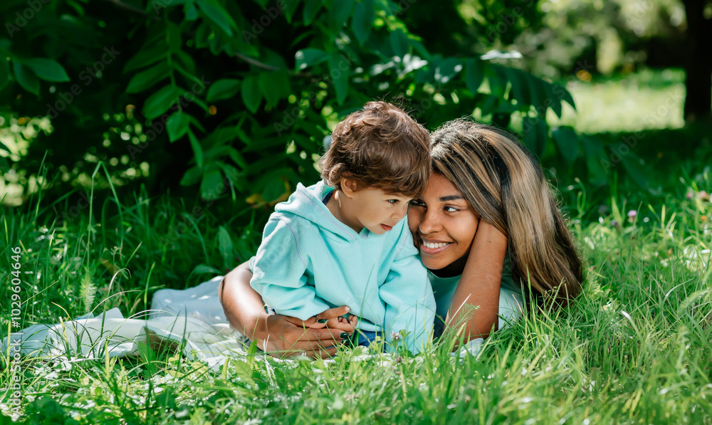 Portrait of a happy black mother and son playing outdoors . African American baby and his mom together in the park. Portrait of a happy black mother and son playing outdoors . African American baby and his mom together in the park.