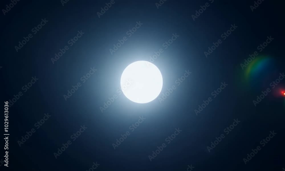 A bright, circular light against a dark background, resembling the moon or a light source. A bright, circular light against a dark background, resembling the moon or a light source.