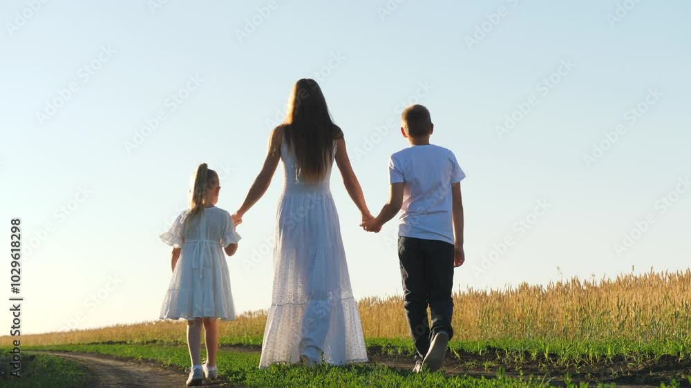 mother child daughter son walk sunset, hold hands. happy family, wheat field, chidhood dream, cheerful people park, woman child park sunset, kid runs, agriculture concept, enthusiastic children mother child daughter son walk sunset, hold hands. happy family, wheat field, chidhood dream, cheerful people park, woman child park sunset, kid runs, agriculture concept, enthusiastic children