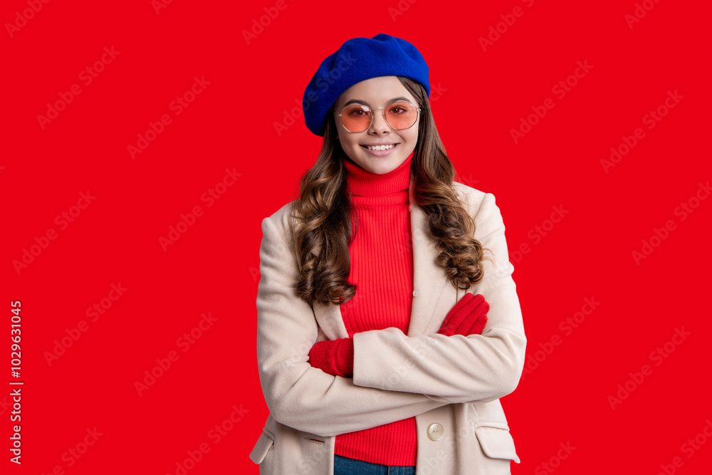 Fall fashion style for teen. Complete outfit for the fall style. Girl in autumn beret. Teen girl isolated in red. Autumn fashion girl. Trendy and stylish teenager girl smiling. Trench coats Fall fashion style for teen. Complete outfit for the fall style. Girl in autumn beret. Teen girl isolated in red. Autumn fashion girl. Trendy and stylish teenager girl smiling. Trench coats