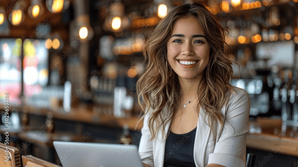 Confident Latina Businesswoman Working on Laptop in Cafe Confident Latina Businesswoman Working on Laptop in Cafe