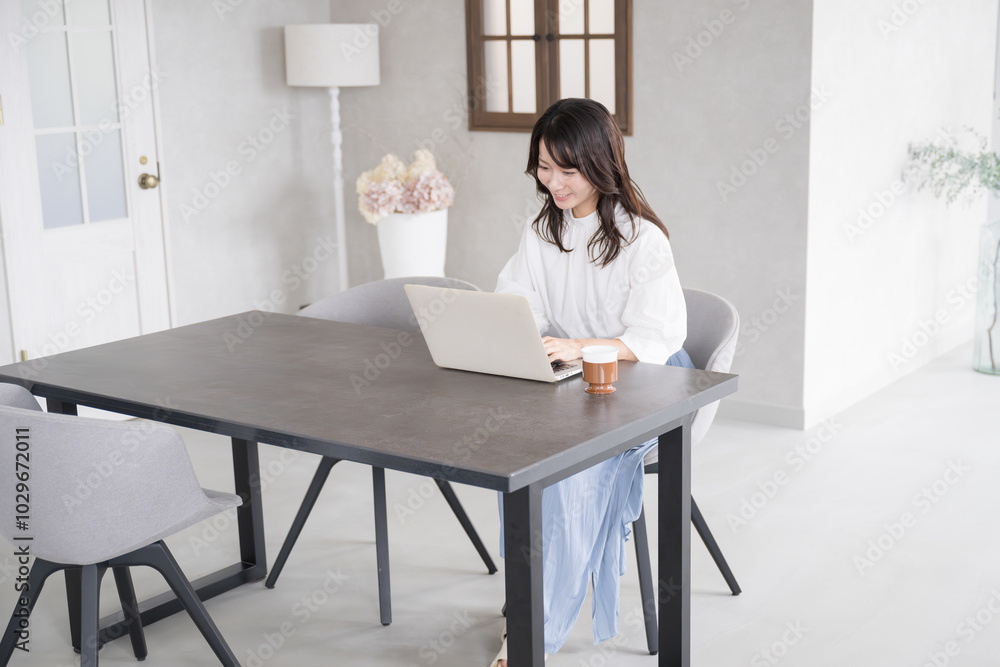 Smiling young woman whole body looking at computer