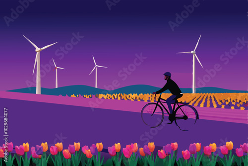 A man cycling through a field of tulips with wind turbines in the background.