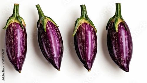 Wallpaper Mural Four purple eggplants sit in a row on a white surface Torontodigital.ca
