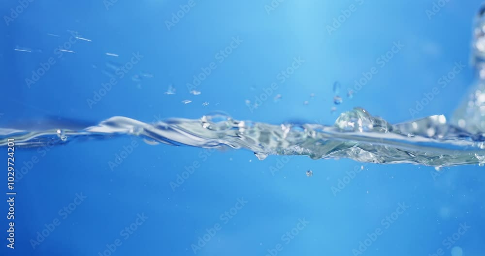 Dynamic close-up of sparkling water, illustrating the refreshing nature and clarity of high-quality drinking water. Dynamic close-up of sparkling water, illustrating the refreshing nature and clarity of high-quality drinking water.