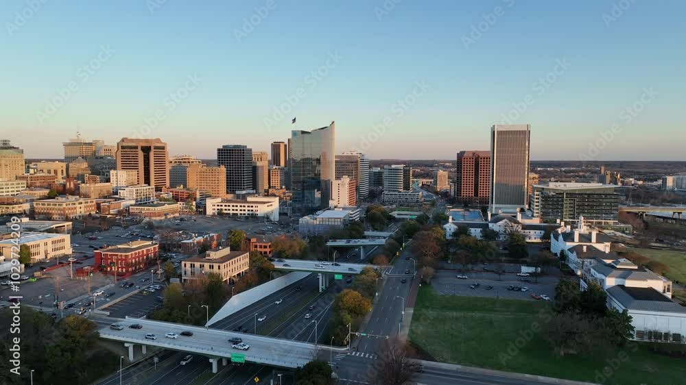Drone 4k video of Richmond Virginia skyline at sunset. Golden light reflects on buildings as drone moves from left to right. Drone 4k video of Richmond Virginia skyline at sunset. Golden light reflects on buildings as drone moves from left to right.