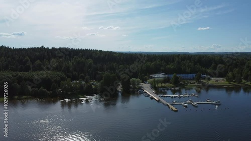 Motorboats moored at small marina in national park lake in Finland photo