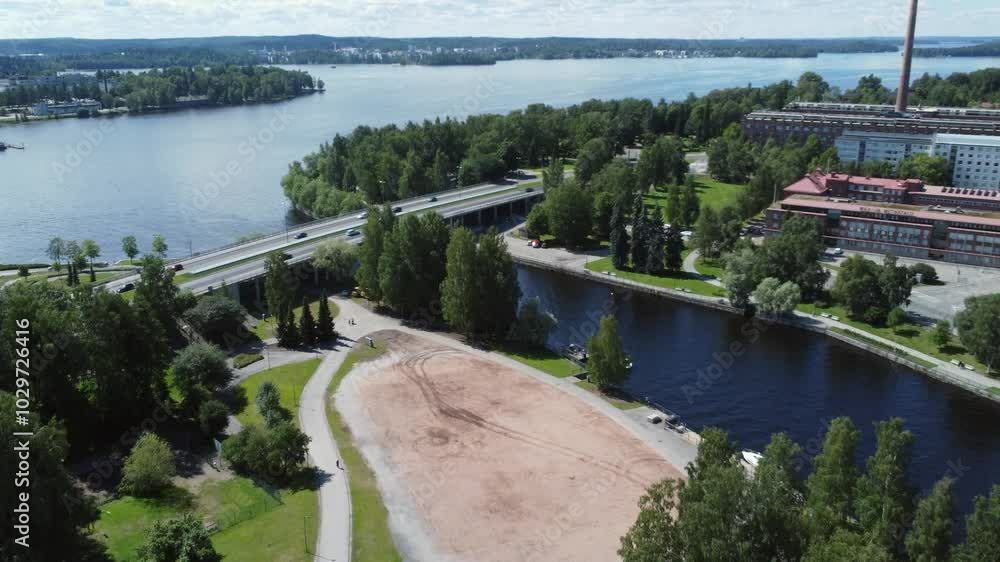 Car traffic on short bridge crossing river canal in Tampere, Finland Car traffic on short bridge crossing river canal in Tampere, Finland