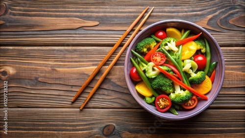 Colorful vegetable bowl with chopsticks on wooden table, vegetables, carrots, celery, bowl, colorful, healthy, fresh