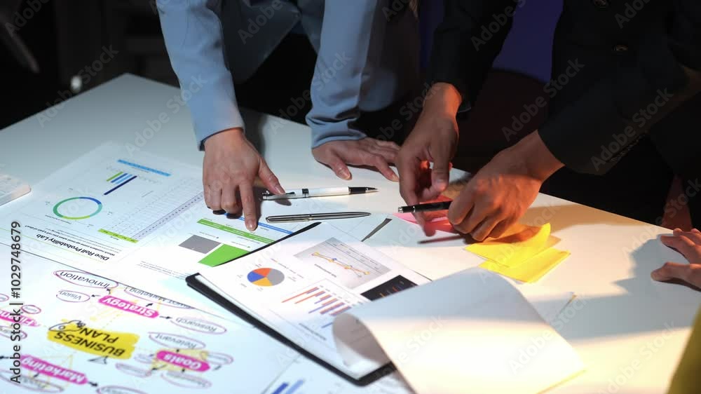 Business team analyzing data and brainstorming ideas Business team analyzing data and brainstorming ideas