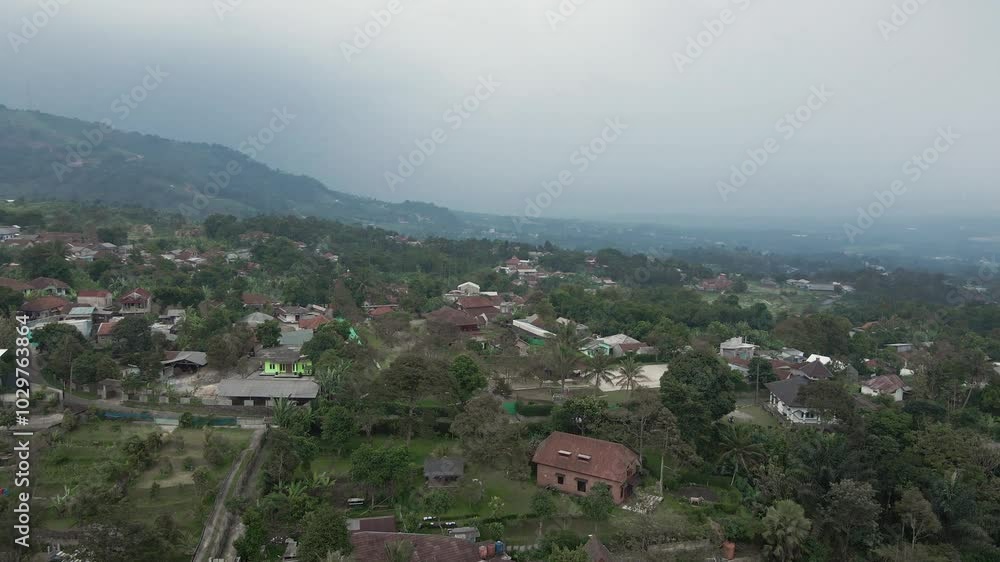 Drone video of a rural atmosphere with mountains in the background, the drone moving forward and the camera facing forward
Drone video of a rural atmosphere with mountains in the background, the drone moving forward and the camera facing forward