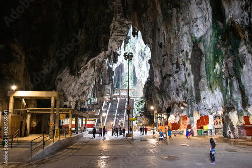 Tourists exploring the batu caves landmark in kuala lumpur, malaysia photo