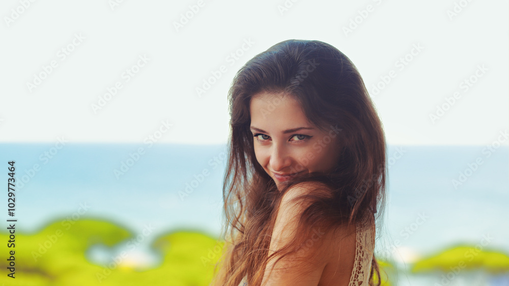 Beautiful happy woman joying on blue sea and sky summer warm background. Closeup enjoying lifestyle Beautiful happy woman joying on blue sea and sky summer warm background. Closeup enjoying lifestyle