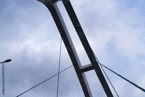 Low-angle view of the bridge pier on a cloudy day