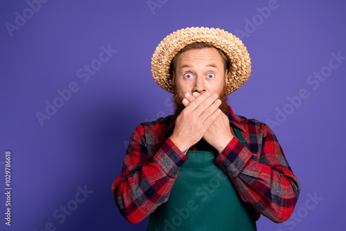 Photo of man farmer wear checkered shirt cover mouth halloween party fear horror empty space isolated on purple color background