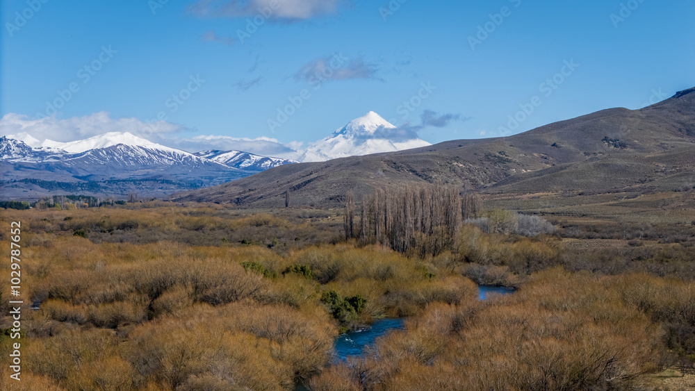 Natural frame of a green landscape with Lanín Volcano in the background on a sunny day. Natural frame of a green landscape with Lanín Volcano in the background on a sunny day.