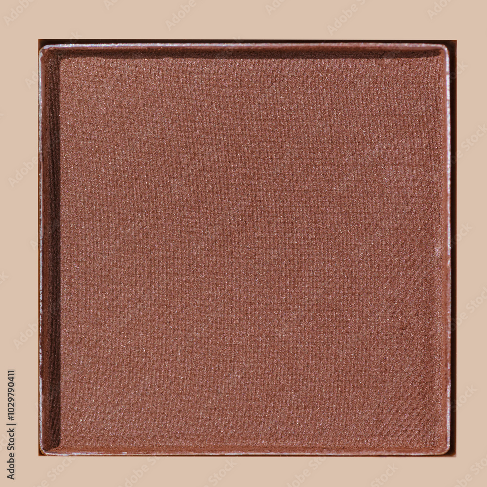 Fototapeta premium Closeup view brown with golden shimmer eyeshadow, warm, metallic shade on beige, sun shadow, detail texture, One Glitter Swatch makeup powder eyeshadow, makeup palette, cosmetic beauty product
